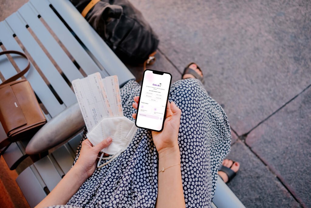 mockuuups woman holding iphone mockup and train tickets